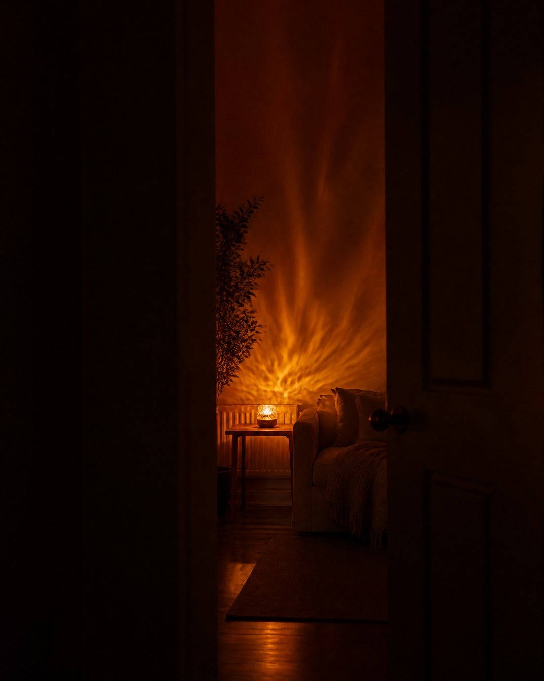 Havie lamp glowing in a cozy bedroom